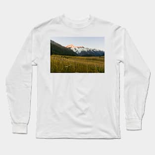 Mount Cook National Park at daybreak as rising sun strikes peaks of surrounding mountains Long Sleeve T-Shirt